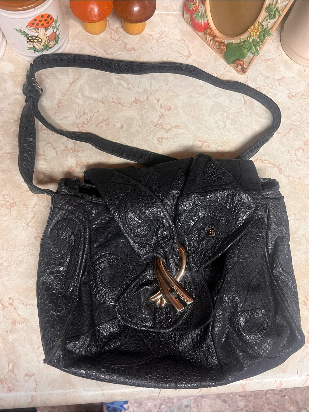 Black Embossed Leather Shoulder Bag with Decorative Metal Loop